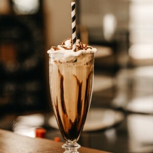 full-filled cream glass on table