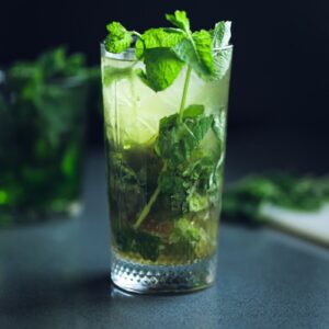 a glass jar with a plant inside