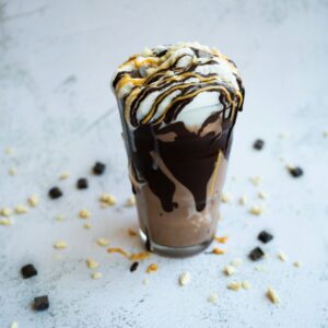 a chocolate milkshake with a drizzle of chocolate on top
