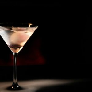 A martini glass sitting on top of a table