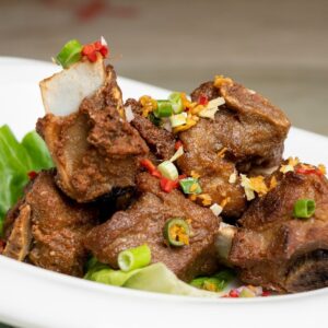 a close up of a plate of food with meat