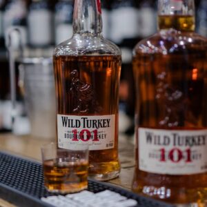 Two bottles of wild turkey 101 bourbon whiskey.