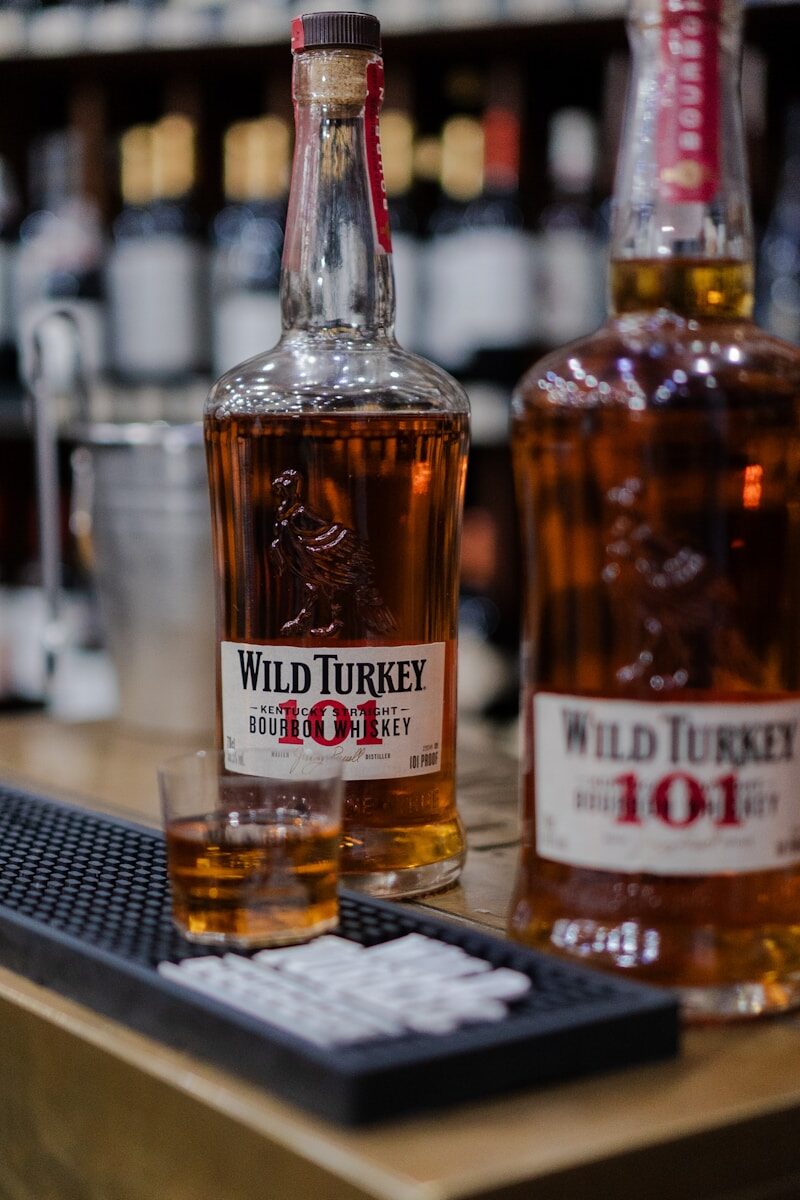 Two bottles of wild turkey 101 bourbon whiskey.