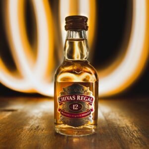 UNKs gold bottle on brown table